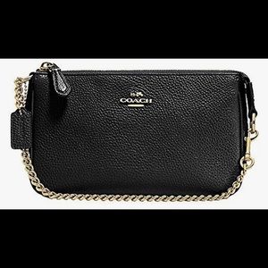Pebbled leather Coach wristlet with gold chain strap.